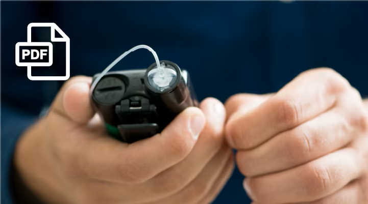 Hands holding a 770G insulin pump