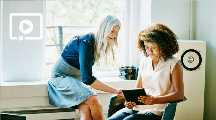 Two women looking at a tablet