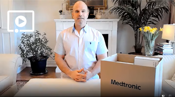 a man standing behind a box
