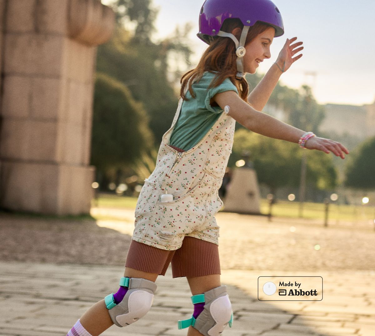 Girl roller skating with MiniMed Flex system
