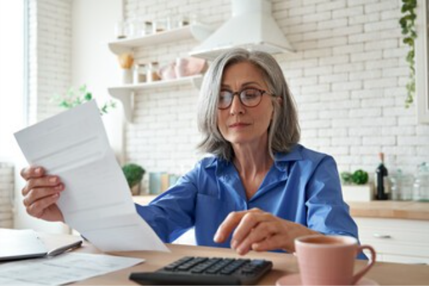 Woman using calculator