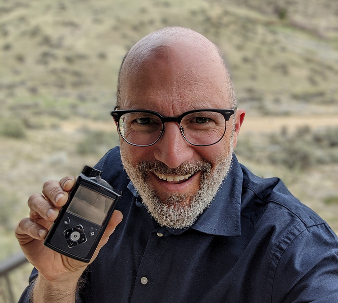 Engineer holding MiniMed pump