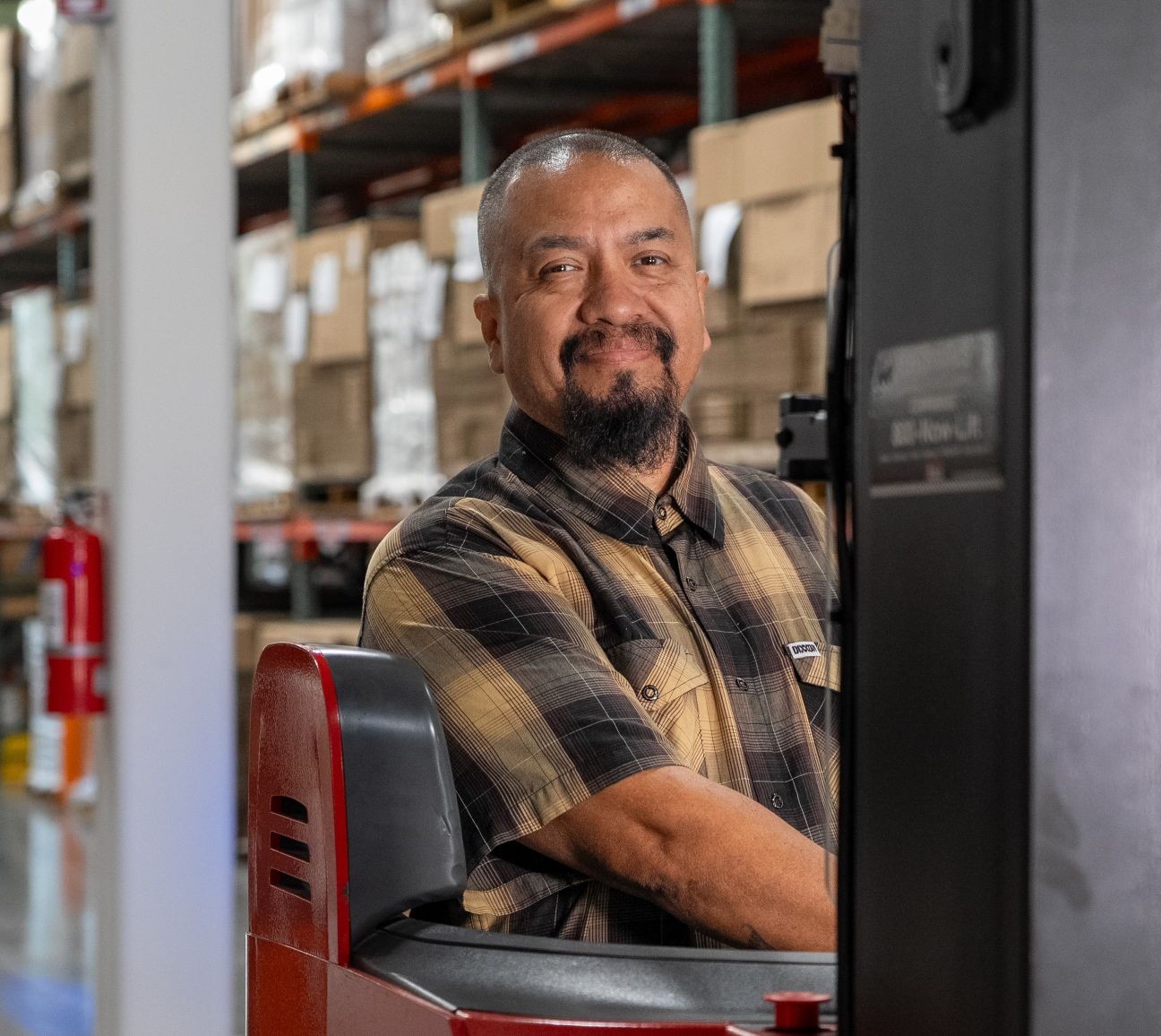 Warehouse worker on forklift