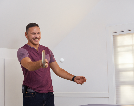 Yonatan playing pingpong, wearing 780G pump