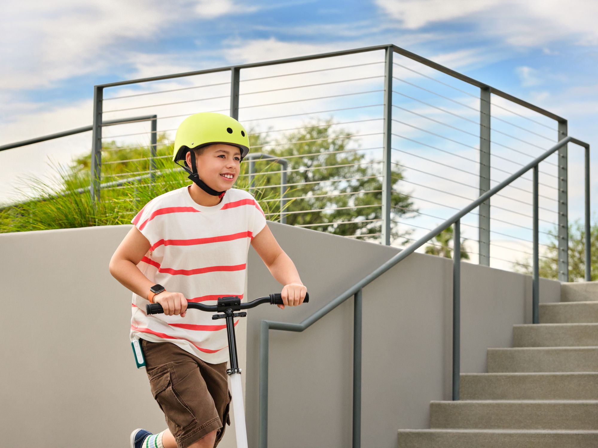MiniMed Champion Masen on scooter with MiniMed Flex