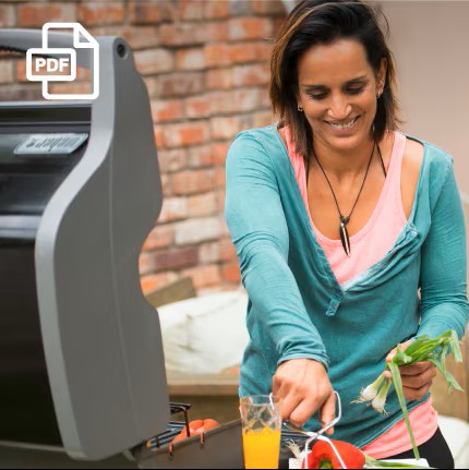 Woman cooking on a grill